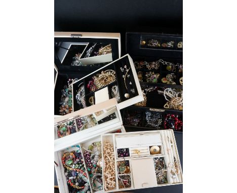 A large collection of mixed contemporary and vintage costume jewellery contained within three boxes. 