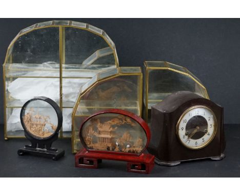 A box of mixed collectables to include a bakelite Smiths clock, two oriental cork carvings and two glass cabinets. 