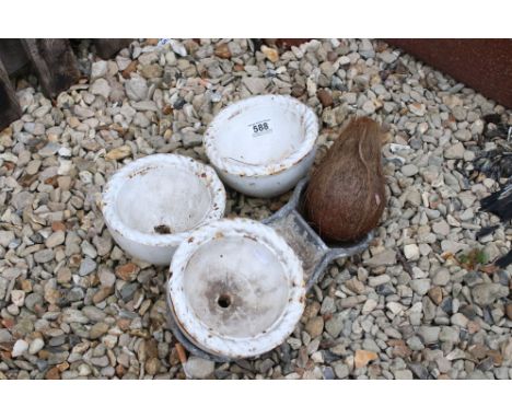 A collection of three vintage cast iron Coconut shy cups. 