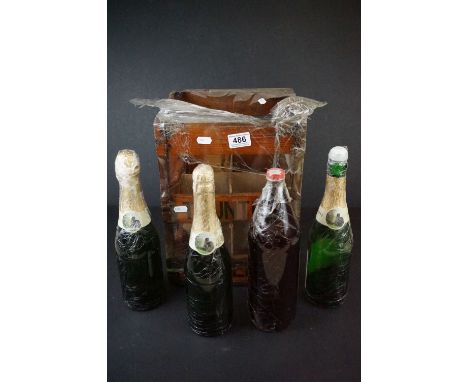A mid 20th century Taunton Cider wooden bottle cage together with four vintage bottles of cider. 