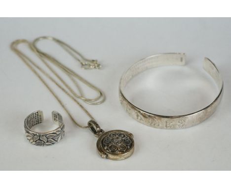 Chinese 999 silver jewellery set to include a bangle, ring, chain and pendant 