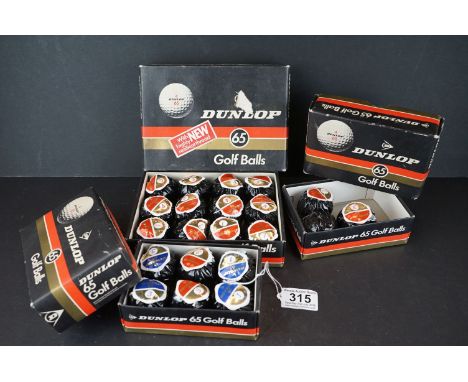 A collection of vintage Dunlop 65 golf balls in original packaging. 