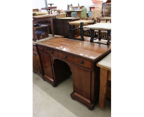 Early 19th century Mahogany Twin Pedestal Desk with two drawers over an arched kneehole and two panel doors opening to shelve