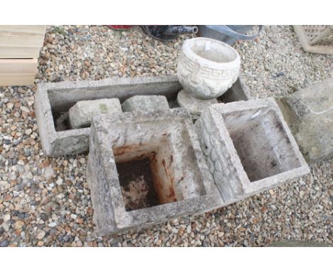 Reconstituted stone planter of long form, with two matching planters and one other. 