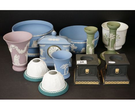 Quantity of Wedgwood Jasperware - to include a quartz mantle clock, bowl, tazza, a pair of candlesticks, a pair of dark blue 