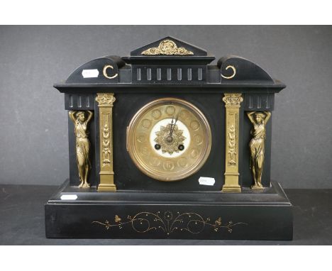 An antique French slate mantle clock with gilt decoration. 