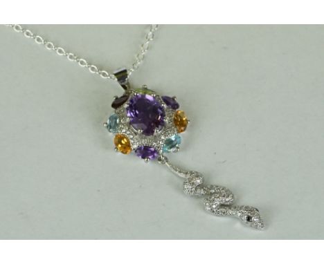 Unusual silver snake pendant necklace made up of central amethyst, citrine and aquamarines 