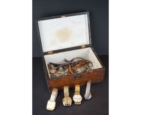 A small collection of vintage wristwatches to include Timex and Roamer examples contained within a wooden box. 