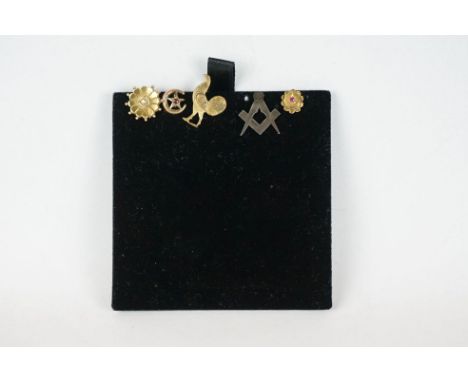 A collection of five gents Tie / cravat pins to include gold and silver examples. 