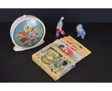 A small group of Noddy collectables to include a Smiths alarm clock with moving head, two ceramic figures and a set of four b