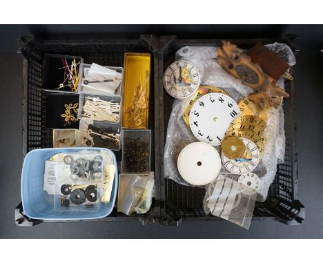 A collection of mixed clock parts to include dials, hands, brackets...etc. 