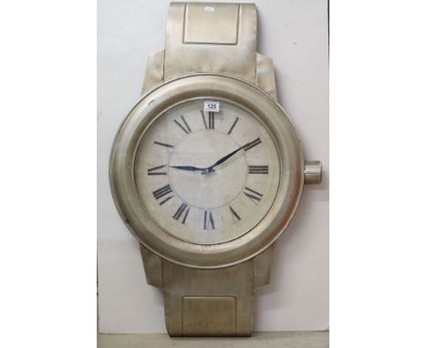 Contemporary Quartz wall clock in the form of an oversized wristwatch 