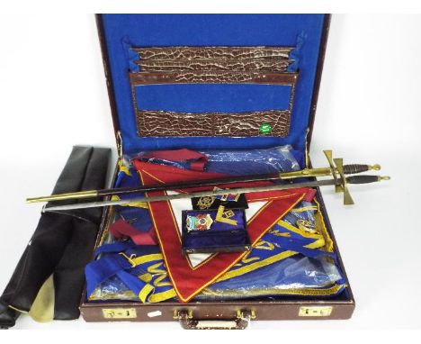 Masonic Interest - A regalia case containing various regalia and jewels and two ceremonial swords, one with brass mounted sca