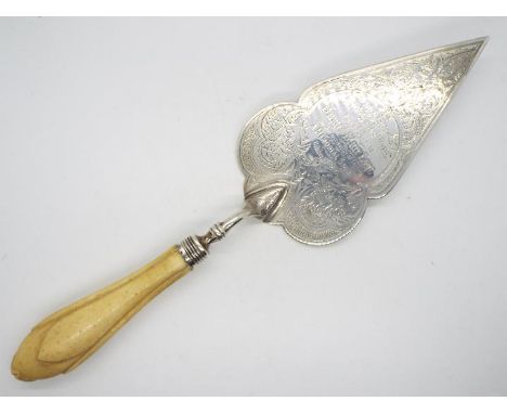 An Edwardian silver presentation trowel with chased decoration and engraved King Street Baptist Church Extension Wigan. Prese