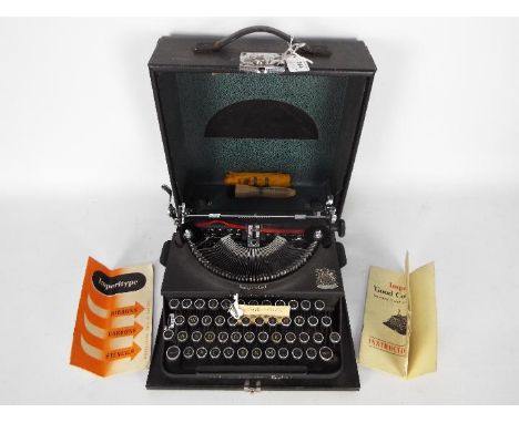 A vintage Imperial Good Companion portable typewriter in carry case.