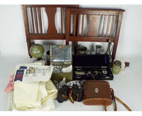 A mixed lot to include vintage linen, pewter, first day covers, vintage tinplate terrestrial globe, binoculars, doll's tea wa