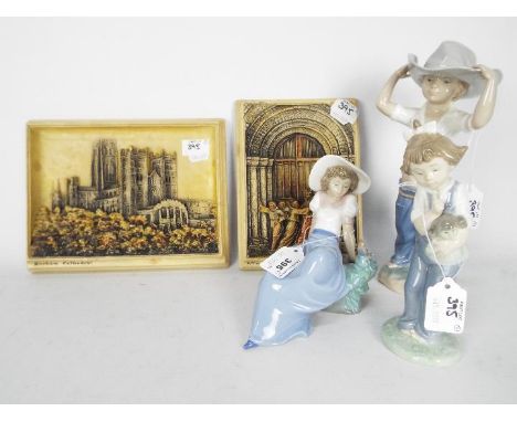 Three Spanish porcelain figurines by Nao, largest approximately 25 cm (h) and two Ivorex wall plaques depicting Durham Cathed