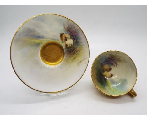 A Royal Worcester porcelain miniature cup and saucer by Ernest Barker, painted to the interior with a scene of two sheep with