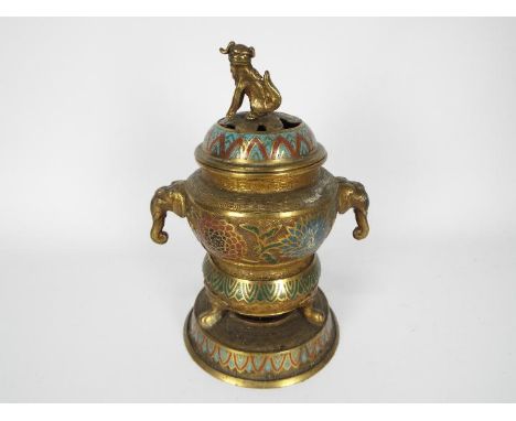 A brass champleve enamel censer and cover with elephant mask handles, approximately 24 cm (h).