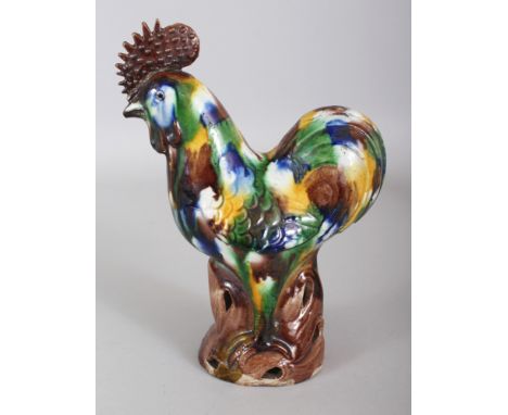 A CHINESE EGG & SPINACH TYPE GLAZED PORCELAIN MODEL OF A COCKEREL, with an additional blue glaze, possibly 18th Century, perc