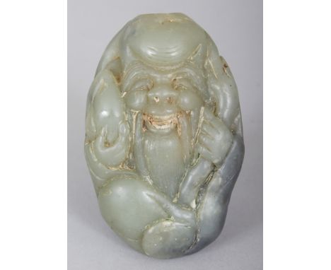 A CHINESE JADE-LIKE HARDSTONE PEBBLE-FORM SNUFF BOTTLE, carved in the form of Shou Lao, 3in long.