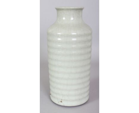 A CHINESE CELADON PORCELAIN VASE, of cylindrical form with ribbed sides and a waisted neck, the base with a Yongzheng seal ma