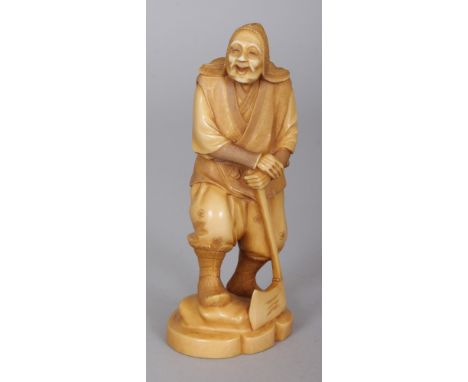 A SIGNED JAPANESE MEIJI PERIOD STAINED IVORY OKIMONO OF A WOODSMAN, leaning on his axe, the base with a carved signature, 5in