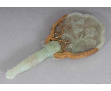 A 20TH CENTURY CHINESE CELADON JADE-LIKE HARDSTONE CARVING OF HAND MIRROR FORM, with gilt-metal mounts, 4.25in wide at widest