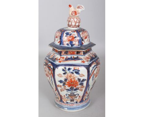 A GOOD EARLY 18TH CENTURY JAPANESE IMARI HEXAGONAL SECTION PORCELAIN VASE & COVER, unusually painted with panels of phoenix a