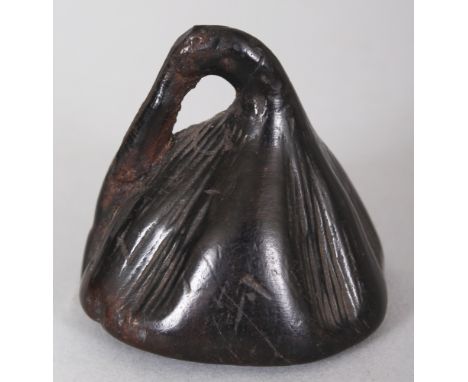 A JAPANESE CARVED WOOD NETSUKE OF A LOTUS POD, 1.6in high.