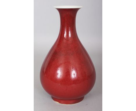 A CHINESE COPPER RED GLAZED YUHUCHUNPING PORCELAIN VASE, the base with a six-character Yongzheng mark, 8.7in high.