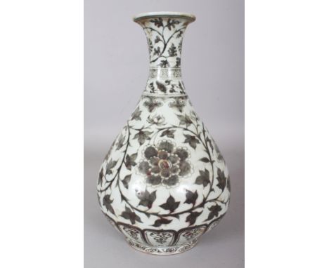 A CHINESE YUAN STYLE COPPER RED YUHUCHUNPING PORCELAIN VASE, decorated with a design of formal scrolling foliage, 12.8in high