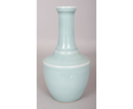 A GOOD QUALITY CHINESE CELADON GLAZED MALLET FORM PORCELAIN VASE, the base with a Qianlong seal mark, 9in high.