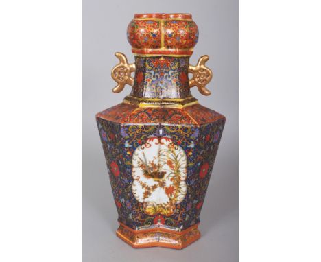 AN ELABORATELY DECORATED CHINESE FAMILLE ROSE PORCELAIN VASE, of double hexagonal section, the base with a four-character Yon