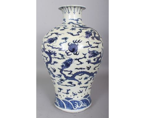 A LARGE 19TH CENTURY CHINESE BLUE & WHITE BALUSTER FORM PORCELAIN DRAGON VASE, 15.25in high.