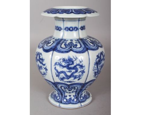 A CHINESE MING STYLE BLUE & WHITE PORCELAIN VASE, the lobed sides decorated with dragon roundels between formal borders, the 