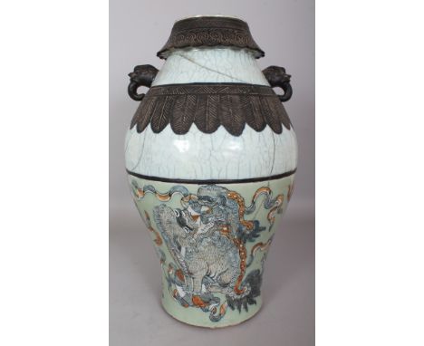 A LARGE 19TH CENTURY CHINESE CRACKLEGLAZE PORCELAIN VASE, the foot with celadon ground decoration of Buddhistic lions, 18in h