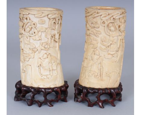 A GOOD PAIR OF LATE 19TH/EARLY 20TH CENTURY CHINESE CARVED IVORY TUSK VASES, together with fitted wood stands, each ivory vas