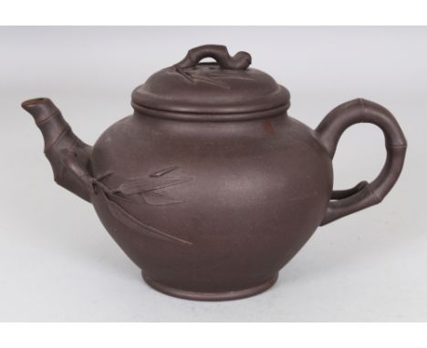 A 19TH/20TH CENTURY YIXING POTTERY TEAPOT & COVER, the bamboo form handle, spout and finial each moulded with a radiating bam
