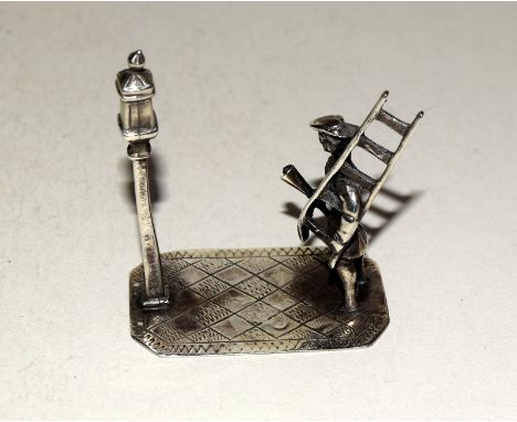 Unusual Oriental silver figure of a lamp cleaner