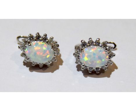 Pair of silver, cz and opal earrings