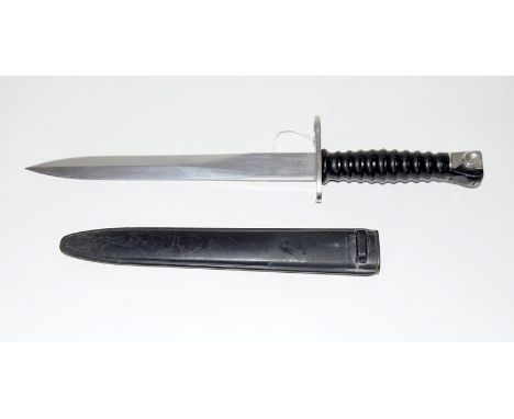 A clean Swiss model 57 double edged bayonet in its scabbard. 24cms blade length