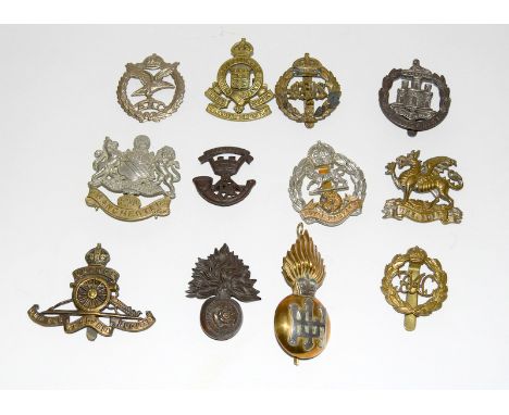 Twelve Army cap badges including a Highland Light Infantry officers silver and brass badge