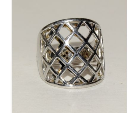 Silver fashion ring with mesh setting and ruby side stone. Size S