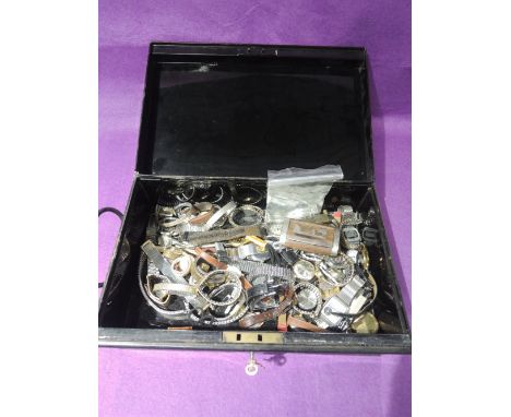 A metal cash box containing a large selection of vintage and modern wrist watches including Ingersoll, Rotary, Rojas, Braddon