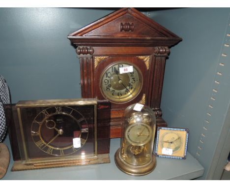A selection of various style clocks including Smiths mantle clock, Anniversary and enamel