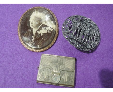 A Victorian yellow metal miniature photograph case initialled for Adelaide Chatterton, a white metal buckle portraying Adam &