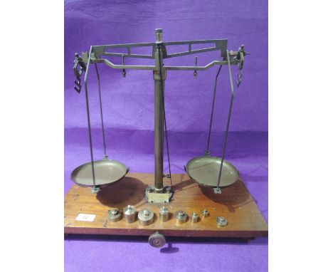 A set of vintage brass weighting scales by Victor, on mahogany plinth