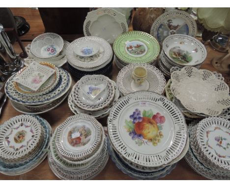 A vast selection of ceramic display plates including hand decorated delft and willow designs