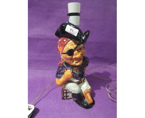 A ceramic figural table lamp in the form of a pirate